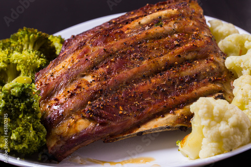 Grilled ribs porkmeat with cauliflower and broccoli photo