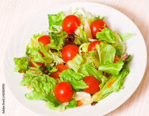 fresh mixed salad leaves with cherry tomatoes