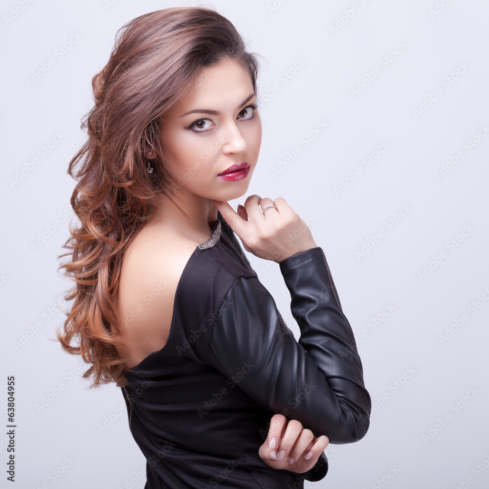 Beautiful brunette professional make up on grey background Beautiful brunette professional make up on grey background