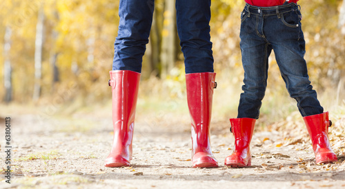 Canvas Print detail of mother and daughter wearing rubber boots
