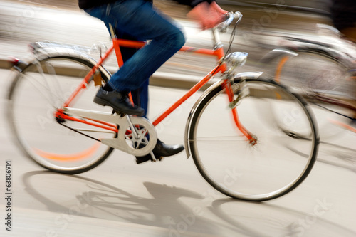 Man on orange bike