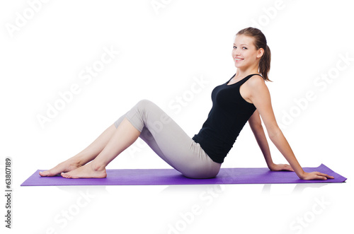 Young sporty woman doing exercises isolated on white