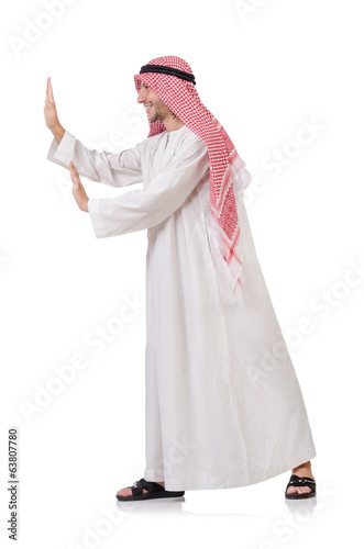 Arab man pushing away virtual obstacle isolated on white