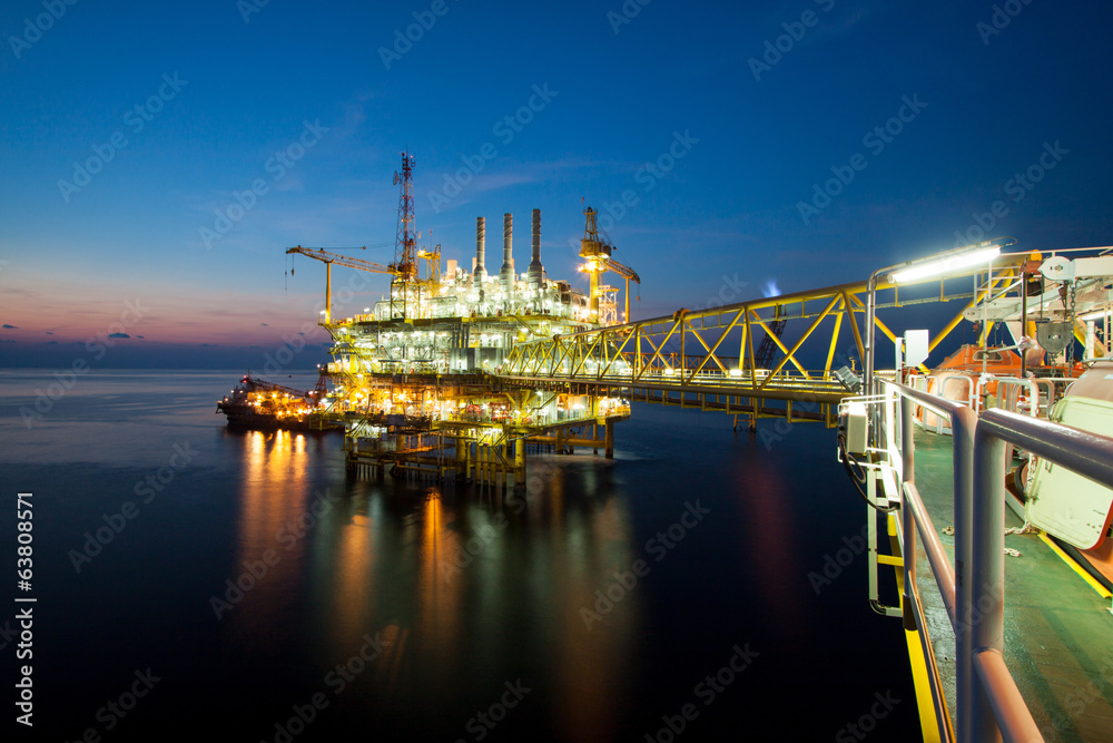 Fototapeta premium Gas platform or rig platform in sunset or sunrise time.