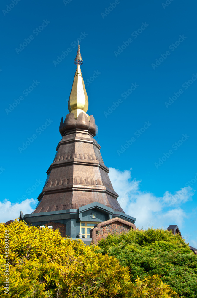 The modern thai style pagoda with blue sky and garden in Thailan