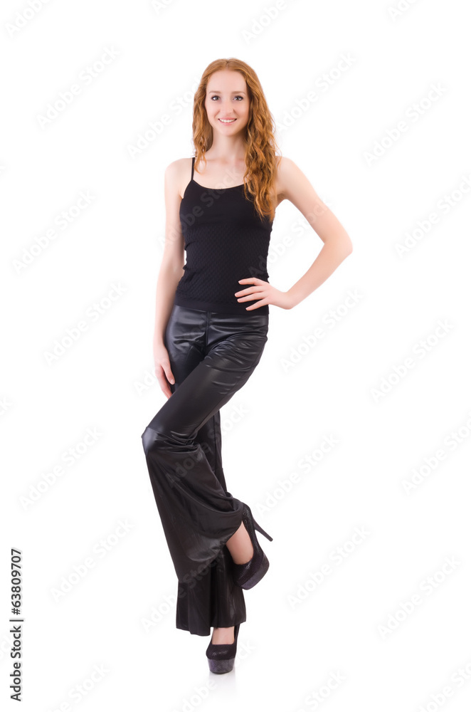 Redhead woman in black bell bottom pants on white Redhead woman in black bell bottom pants on white