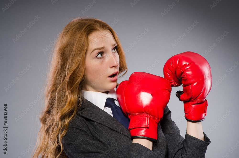 Woman boxer in dark room Woman boxer in dark room