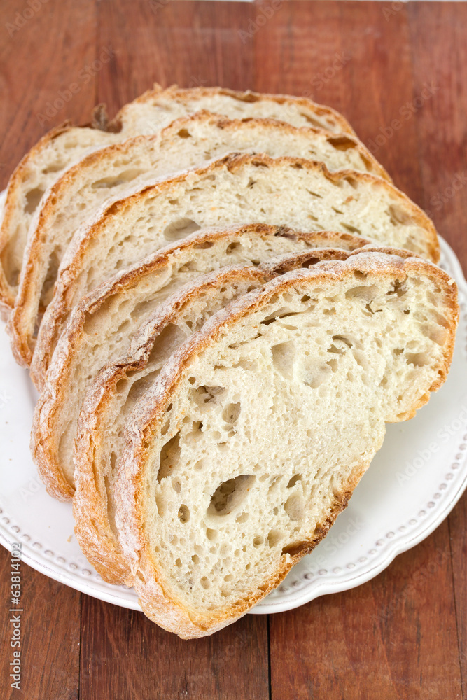 bread on plate on brown background