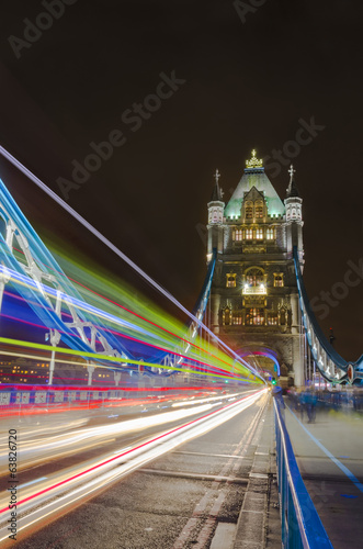 Tower Bridge in London, UK at night with moving light traces