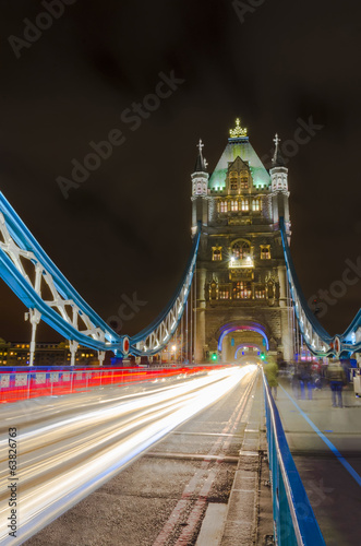 Tower Bridge at night with moving light traces, London, Uk