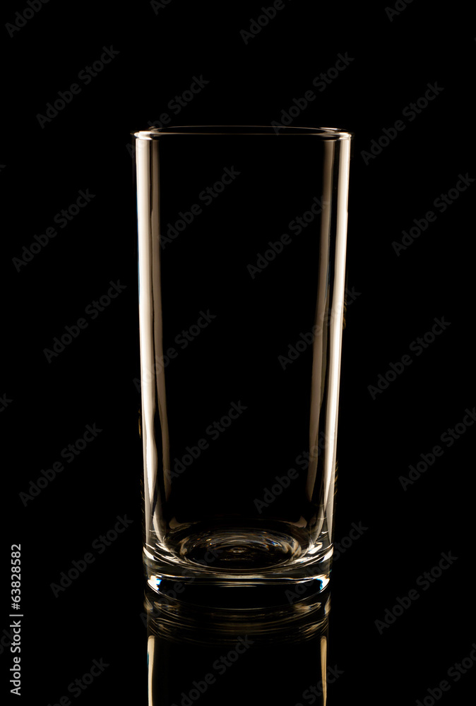 Highball glass in the low-key lighting Highball glass in the low-key lighting