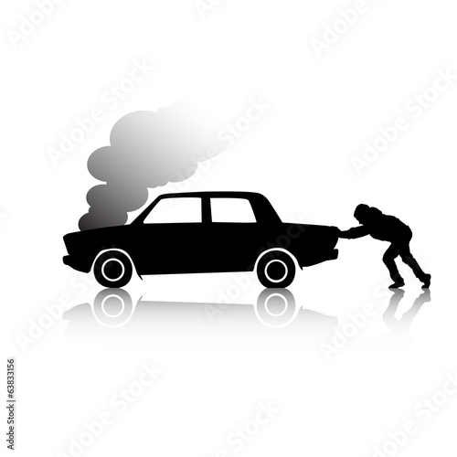 Silhouette of man pushing a broken car