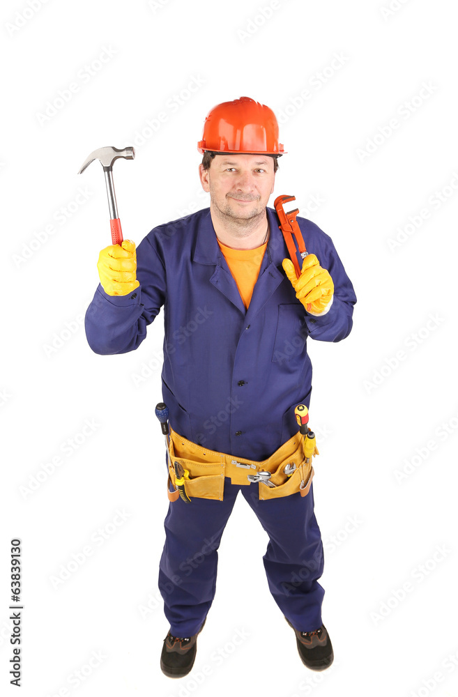 Worker in protective helmet holding hammer. Worker in protective helmet holding hammer.