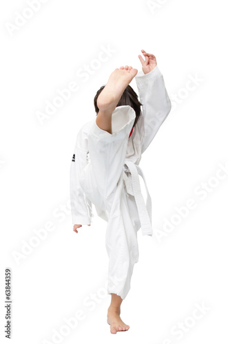 Little tae kwon do boy martial art kick photo