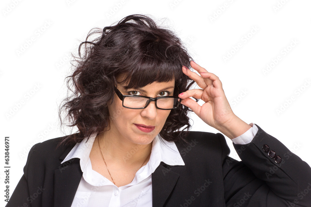 Portrait of mature woman smiling, wearing glasses, looking at ca Portrait of mature woman smiling, wearing glasses, looking at ca