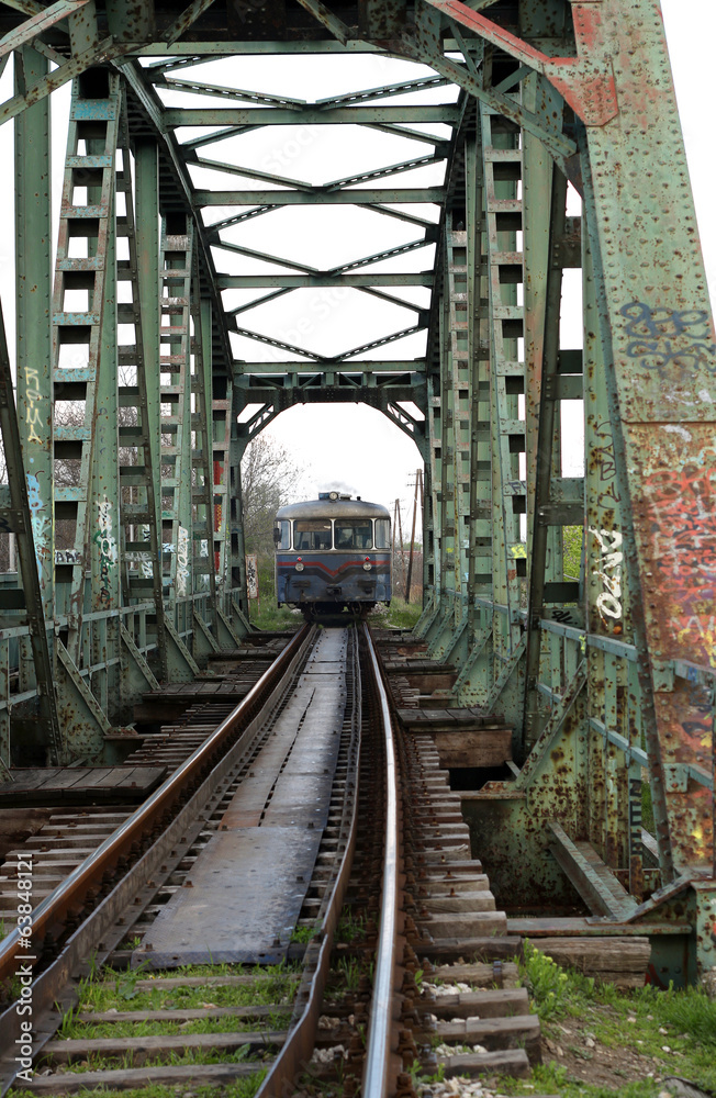 old train on iron bridge