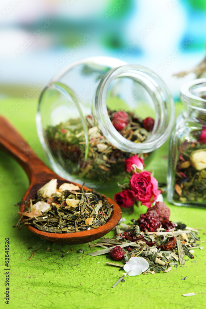 Assortment of herbs and tea in glass jars