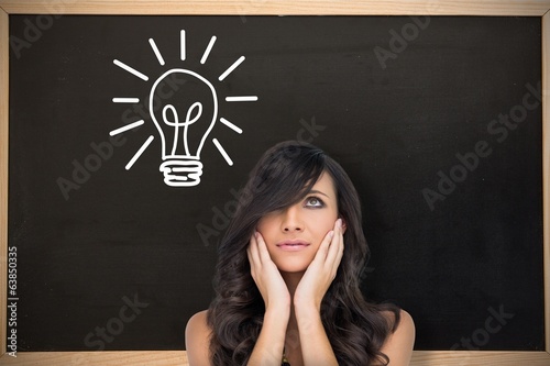Foto Composite image of anxious brown haired model posing holding her