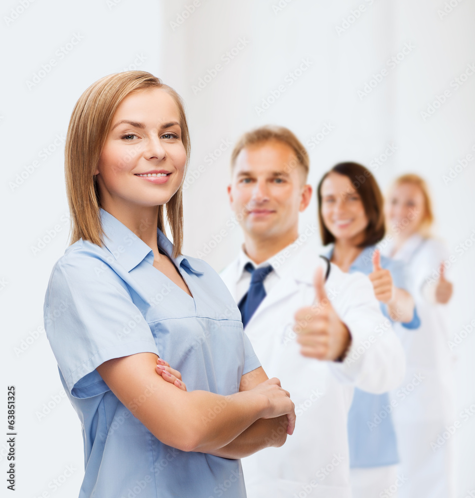 smiling female doctor or nurse smiling female doctor or nurse