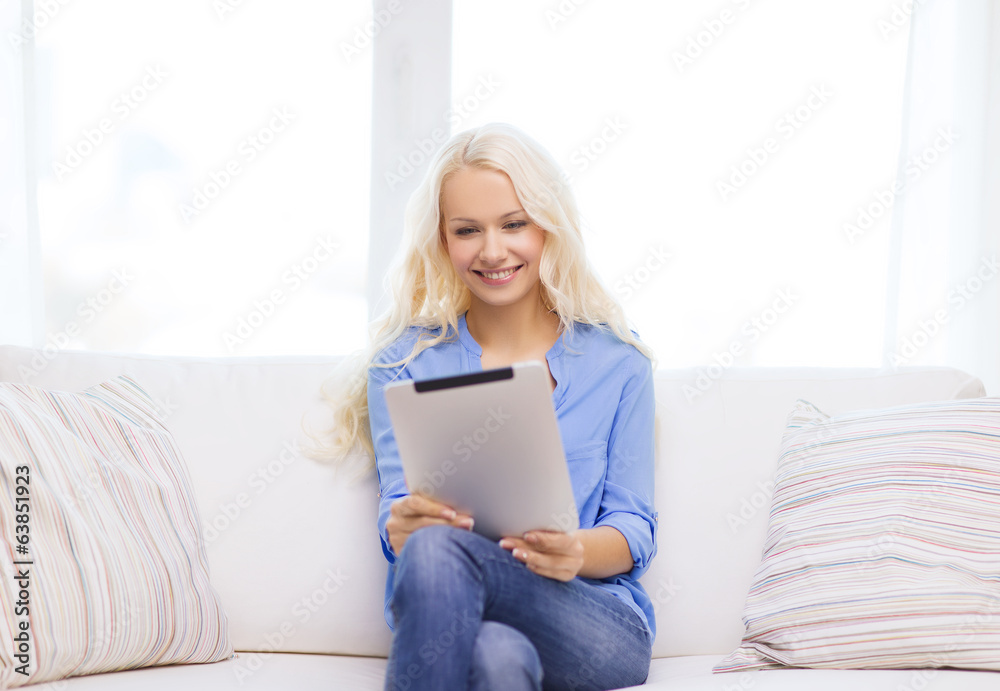 smiling woman with tablet pc computer at home smiling woman with tablet pc computer at home