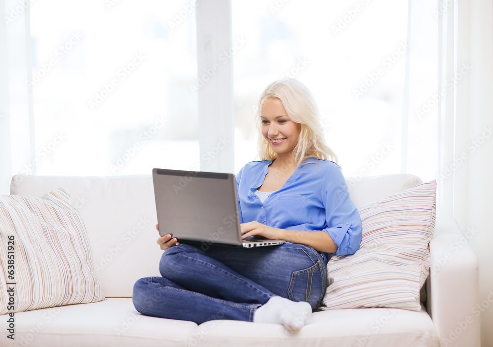 smiling woman with laptop computer at home smiling woman with laptop computer at home