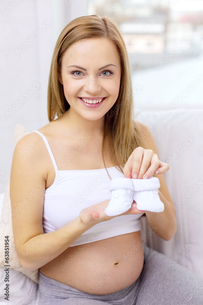 pregnant woman with baby bootees