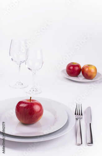 Celebration table set with red apples