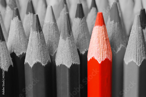 Red pencil among black and white
