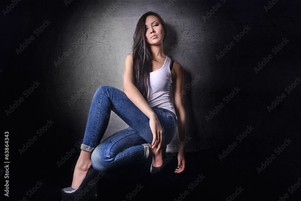 Asian woman model in jeans shirt and shoes with long legs Asian woman model in jeans shirt and shoes with long legs