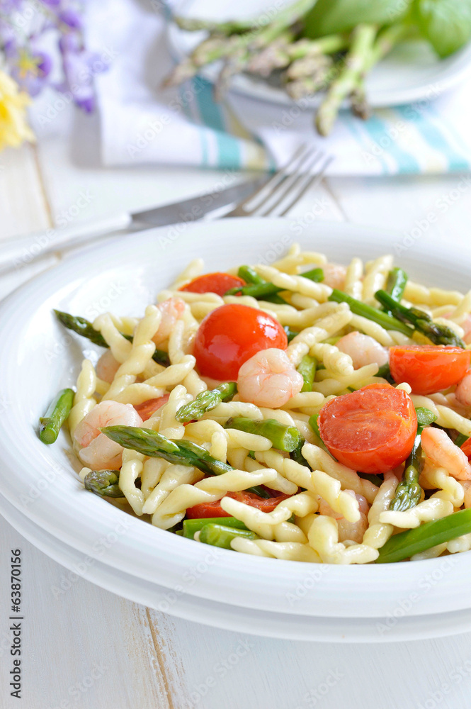 Pasta with asparagus and shrimp. Italian food.