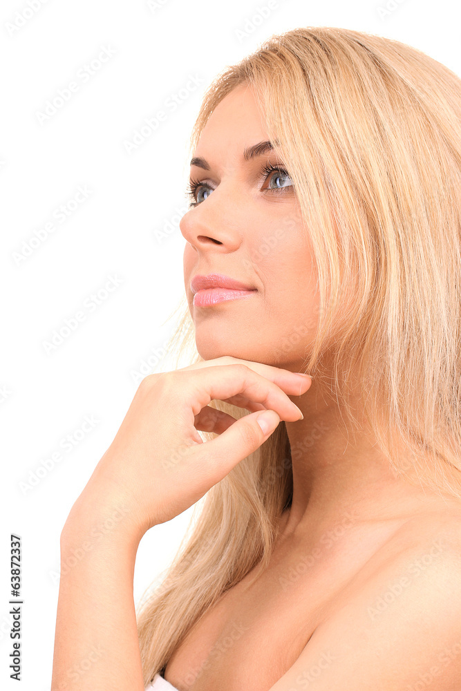 Beautiful young woman's face on white backgroun close-up