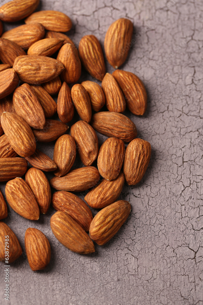 Almonds on color wooden background Almonds on color wooden background