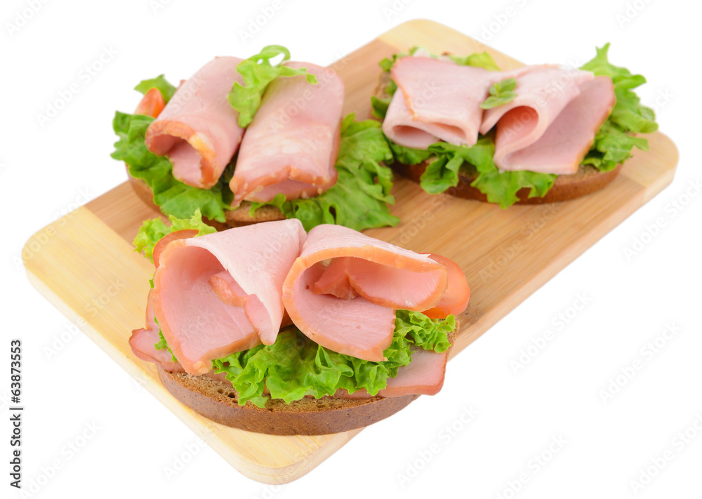 Delicious sandwiches with lettuce and ham isolated on white Delicious sandwiches with lettuce and ham isolated on white