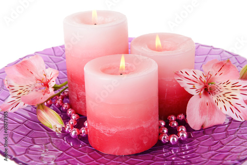 Beautiful candles with flowers close-up