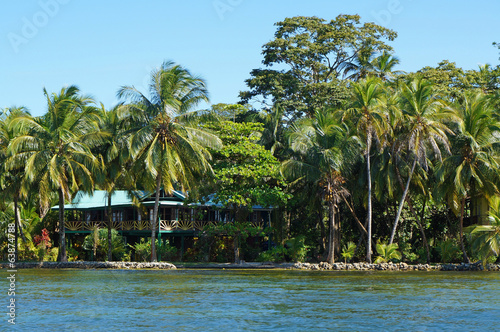 Waterfront house with tropical garden