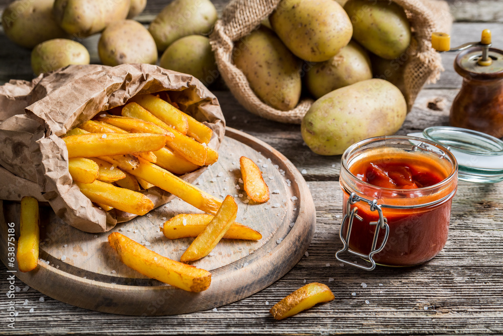 Closeup of homemade fries with ketchup and salt Closeup of homemade fries with ketchup and salt