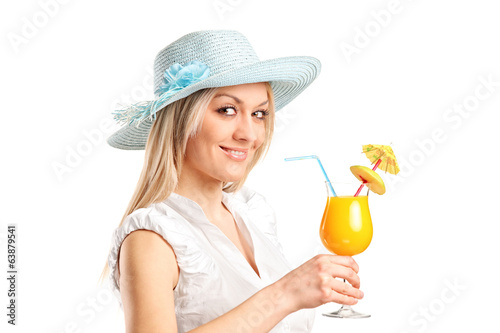 Blond woman holding an exotic cocktail