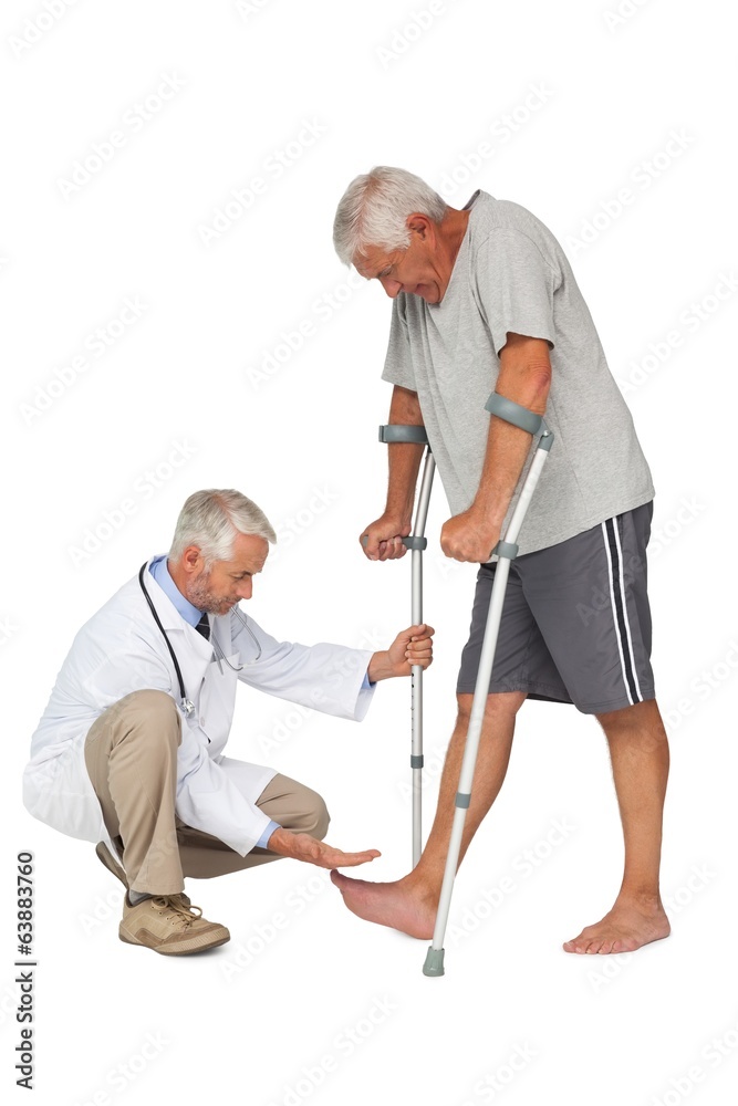 Side view of a doctor with senior man using walker Side view of a doctor with senior man using walker