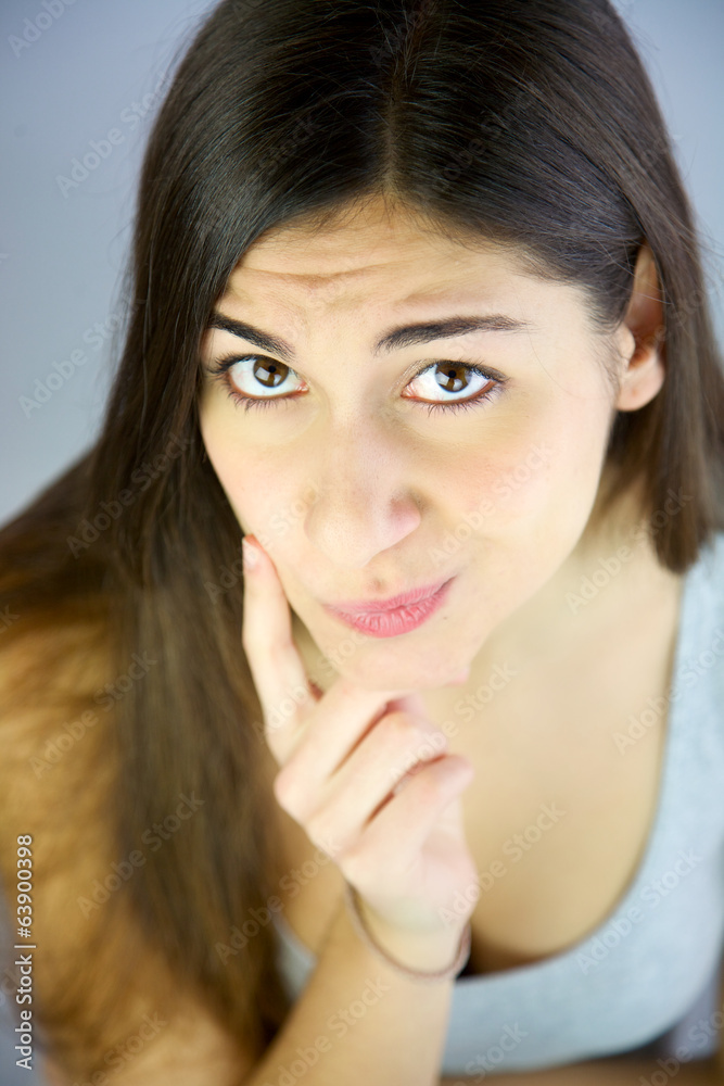 Young woman thinking not able to find solution to problem Young woman thinking not able to find solution to problem