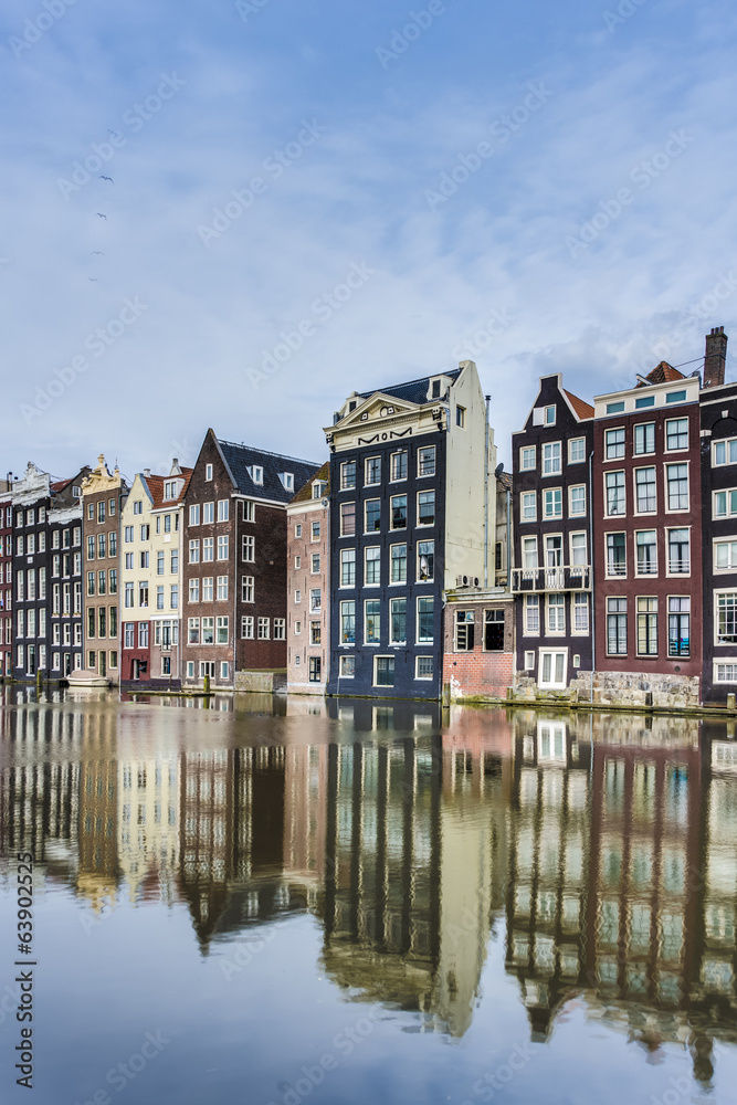 Fototapeta premium The Damrak canal in Amsterdam, Netherlands.