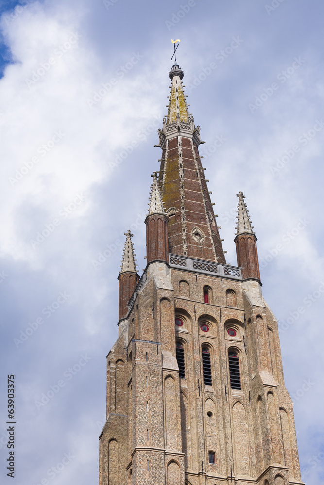 Brickwork tower against cloudy sky Bruges Brickwork tower against cloudy sky Bruges