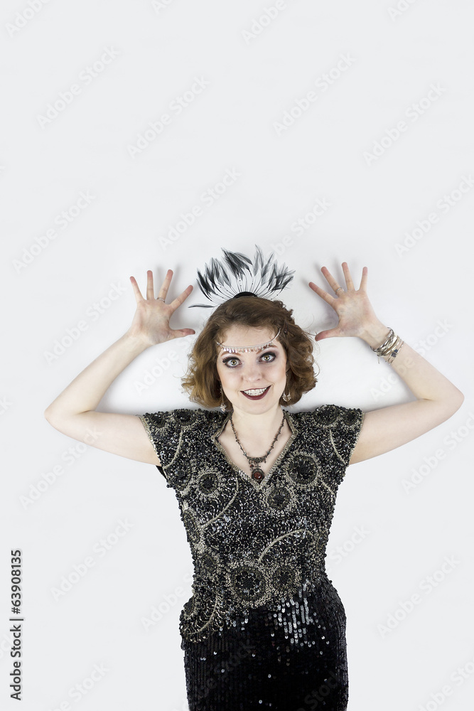 Beautiful young woman dressed as flapper in sequin dress Beautiful young woman dressed as flapper in sequin dress