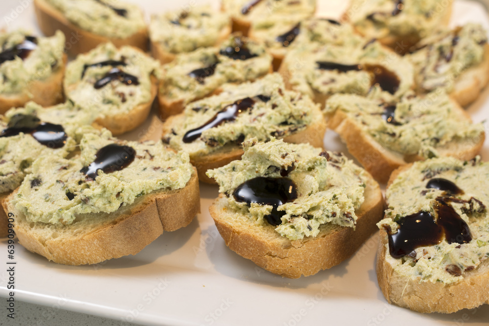 Pesto Crostini with Goat's Cheese and Sun Dried Tomatoes: Balsam