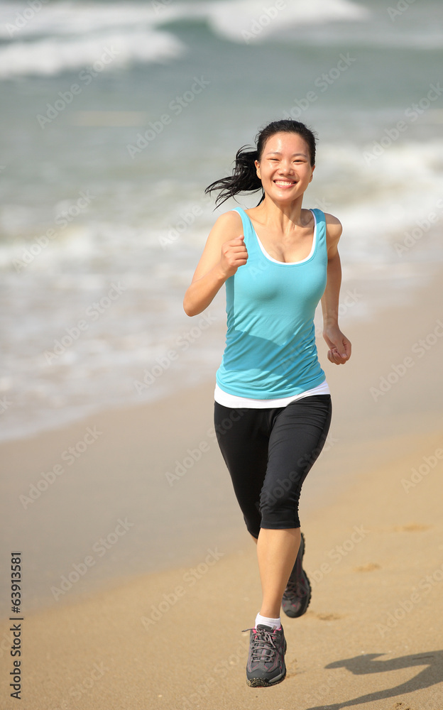 Runner athlete running at seaside beach Runner athlete running at seaside beach