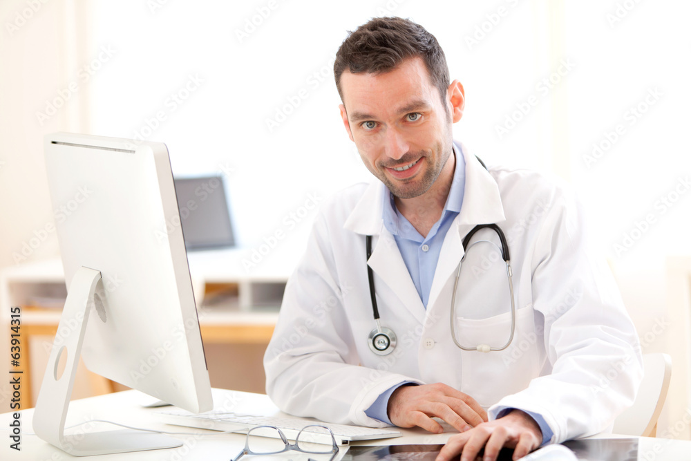 Portrait of a young smiling doctor in his office Portrait of a young smiling doctor in his office
