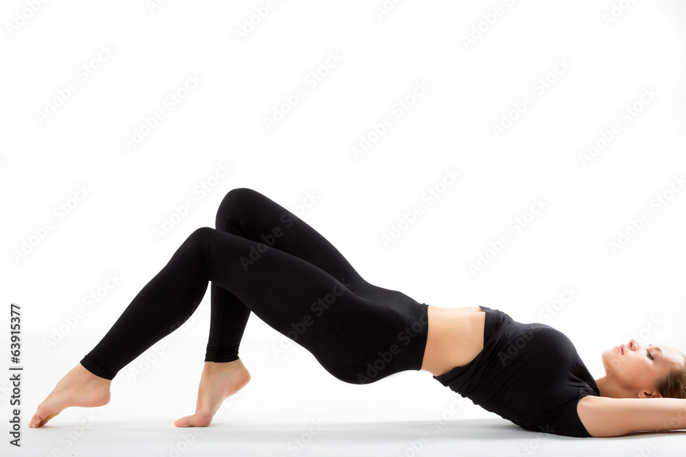 Young sexy sports woman lying on the floor in black sportswear Young sexy sports woman lying on the floor in black sportswear