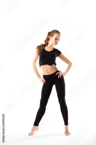 Young woman doing aerobics and stretching, isolated on white bac