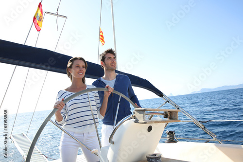 Couple sailing on the mediterranean sea