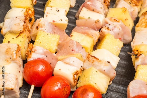 Exotic Skewers With Chicken, Tomatoes, Pineapple And Mozzarella photo