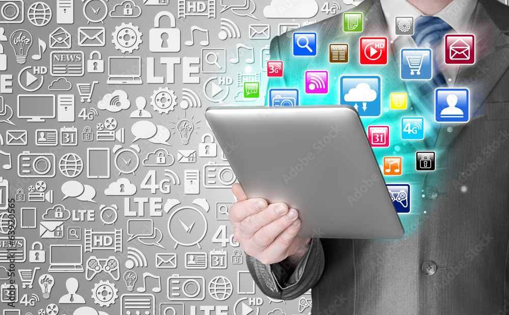 Business man use tablet pc with colorful application icons Business man use tablet pc with colorful application icons